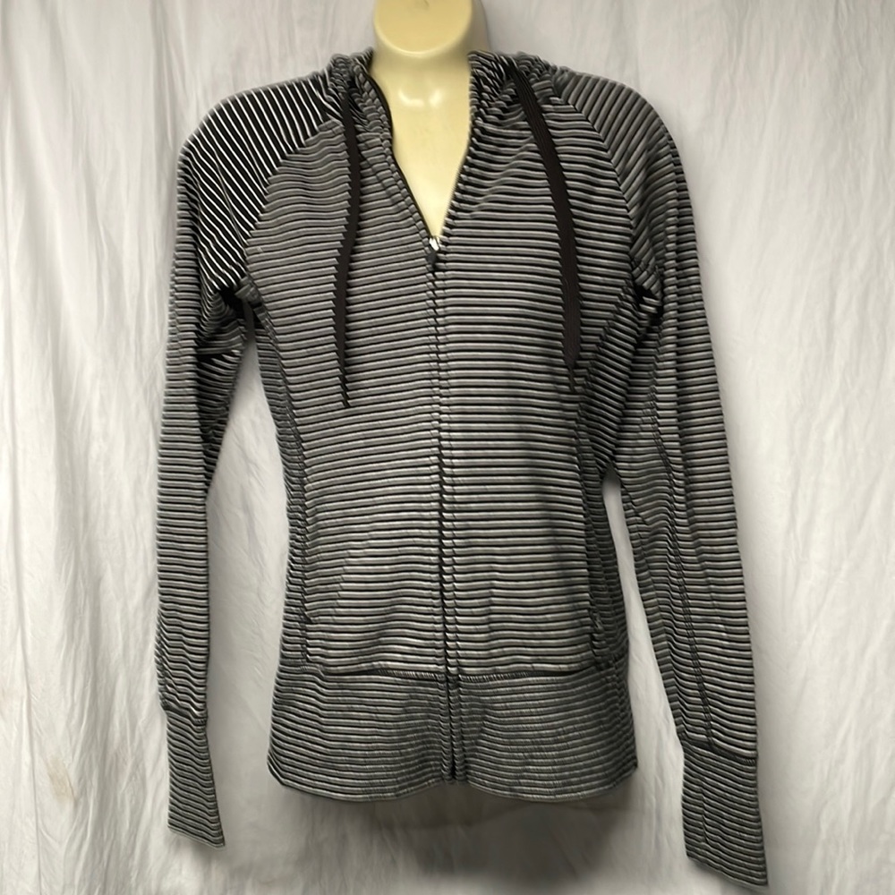 Women’s GAP black and white striped, full zip, form fitting hoodie. Size medium.